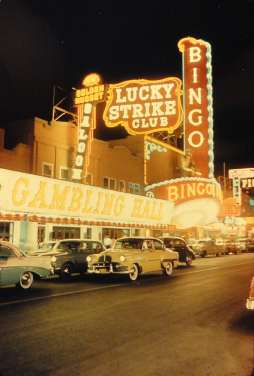 vintagelasvegas:  Lucky Strike Club, Las Vegas, c. 1956-57. Golden Nugget’s slanted Gambling Hall and Saloon signs installed in ‘56; Fortune Club (far right) was closed by Apr. ‘57. Drewry Photocolor slide.