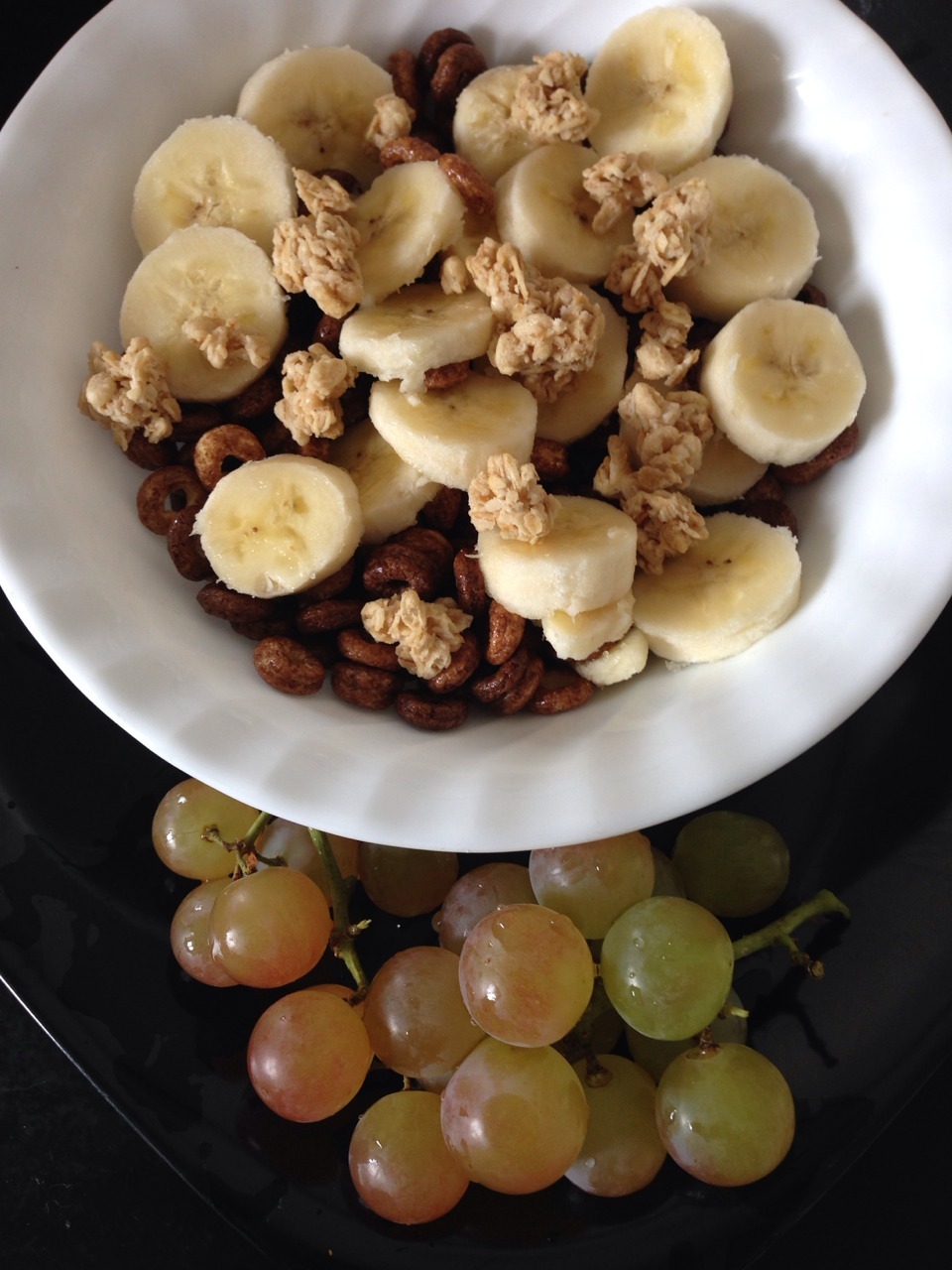 My foodporn for the day. Chocolate Cheerios, banana and organic peanut butter granola.