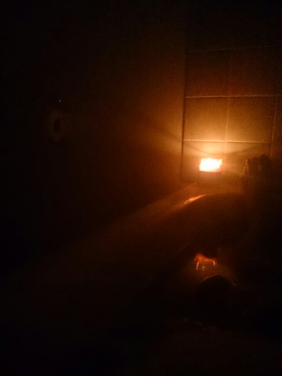 No flash. In tub. Really cold bathroom. Really hot water. The steam in the candle