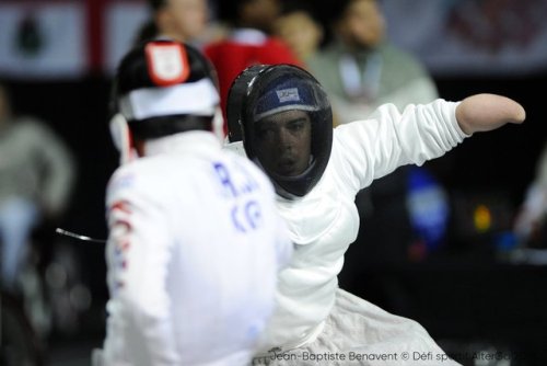 [ID: three photos of a wheelchair epee fencer lunging at his opponent.]Fencing at Montreal 2018!