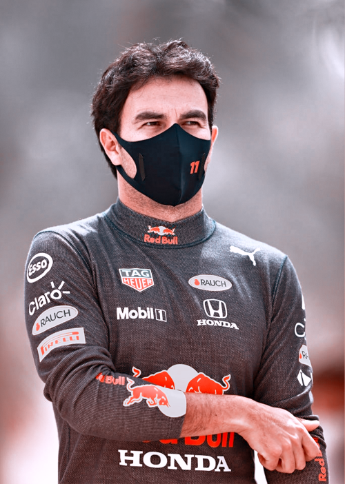 brawn-gp:Sergio Perez walks in the Paddock during previews ahead of Formula 1 Testing at Bahrain Int