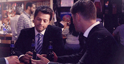 ssjdebusk:  this is the single gayest thing this show has done let’s take gif one where we have cas lightly stroking his beer bottle as he smiles and looks at Dean through his lashes (keep in mind he is supposed to be drunk) then we have gif two where