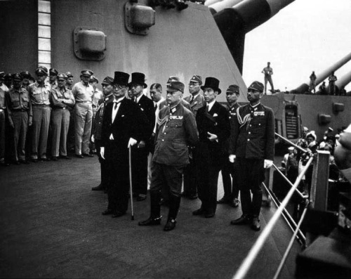 ww2inpictures:The Japanese delegation arrives aboard the American battleship USS Missouri to formall