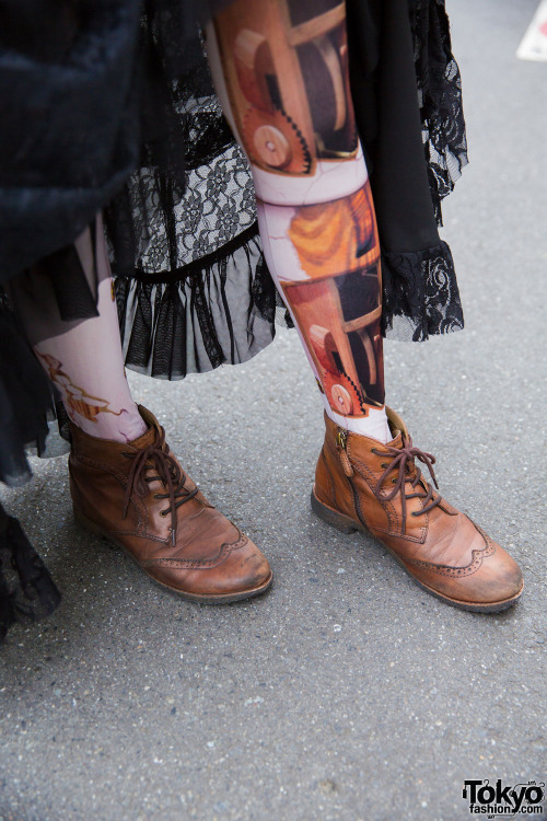 tokyo-fashion:  Keke wearing lolita fashion on the street in Harajuku with a Black Peace Now corset top, black lace skirt and lace jacket from Dangerous Nude Harajuku, and Nude Sox graphic tights. Full Look