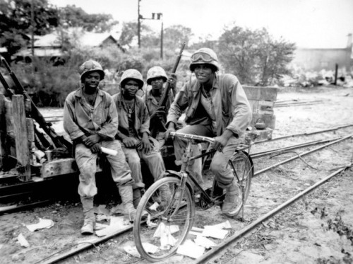 bag-of-dirt:U.S. Marines, attached to the racially segregated 3rd Supply Battalion, on break from th