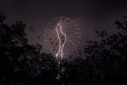 thedailywhat:  Perfectly Timed Photo of the Day: Lightning Steals the Thunder During Fireworks Redditor AJ192 took this spectacular photograph of a lightning in the middle of a fireworks show at Balloon Fiesta Park in Rio Rancho, New Mexico. 