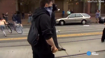   1 may 2015 - A protester kicks back a flashbang grenade thrown by police during the anti-capitalist may day march in Seattle. [video]  