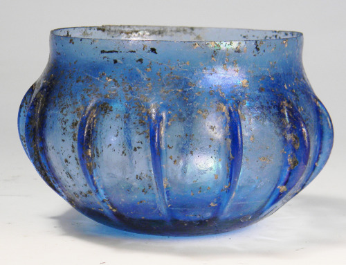rodonnell-hixenbaugh:An ancient Roman transparent blue glass ribbed bowl.www.hixenbaugh.net