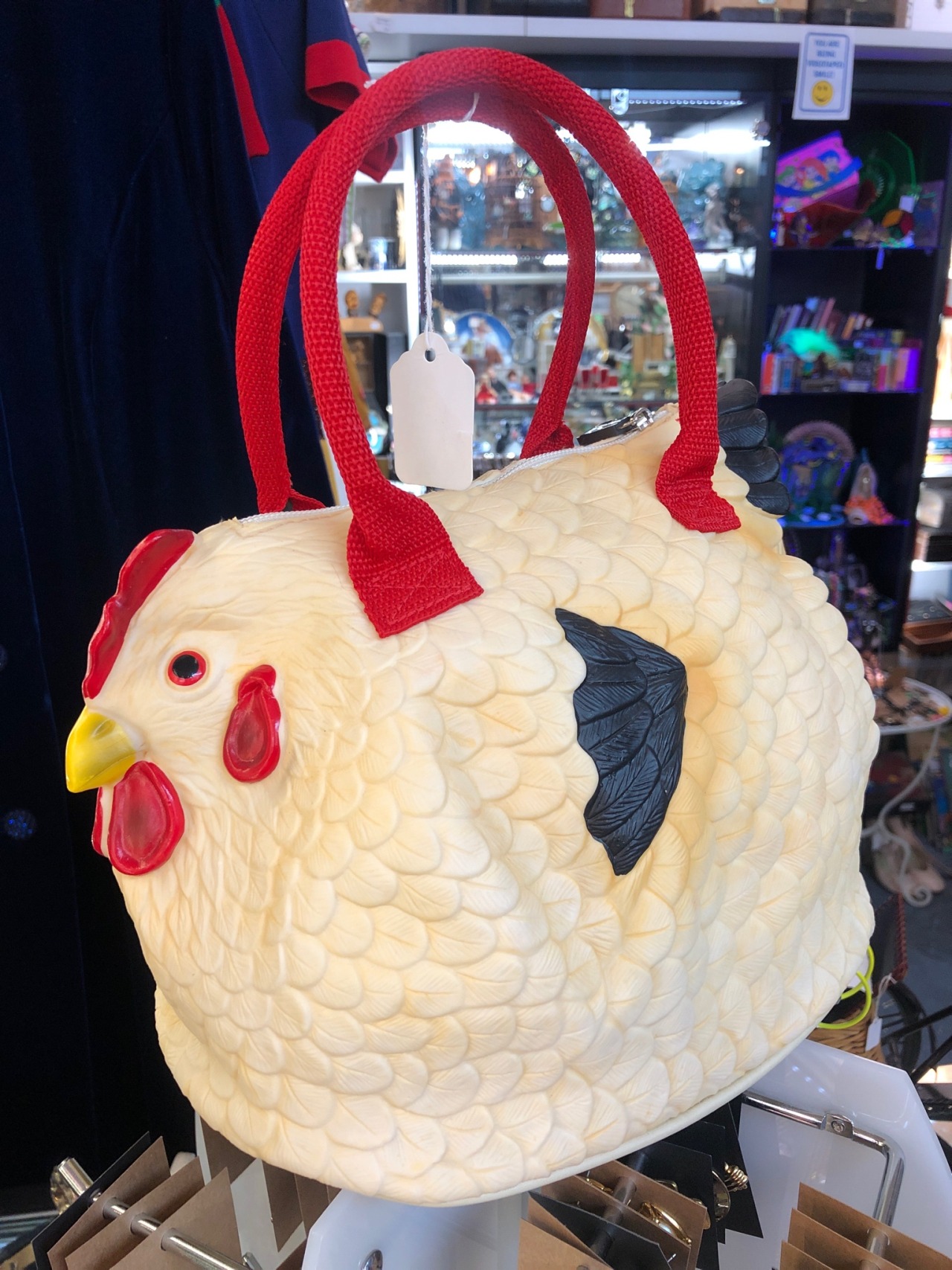 shiftythrifting:Flexible plastic chicken purse… found at an antique mall in the Las Vegas Arts District. I didn’t buy it, but it haunts my thoughts.