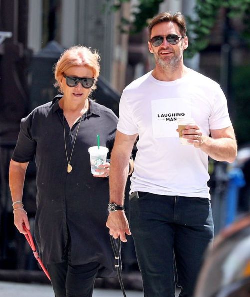 Hugh Jackman Wearing a ‘Laughing Man’ Coffee shop t-shirt out with his wife walking their Dogs Dali 