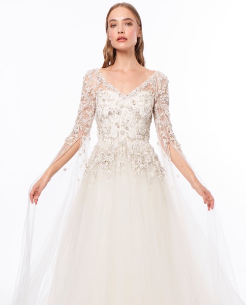 This dreamy Jenny Packham wedding dress is adorned with sparkly floral embellishments on the bodice 