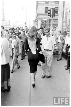 coolkidsofhistory:  Bringing sexy back - Vikki Dougan walking down the street, 1950.  