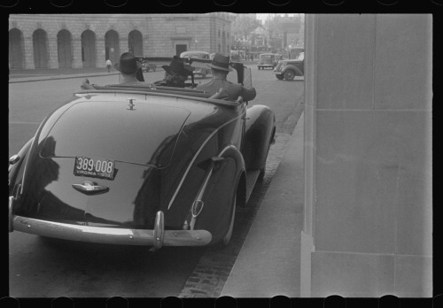 1939. “Washington, D.C. A street scene, showing a car at the entrance of the Office of Interna