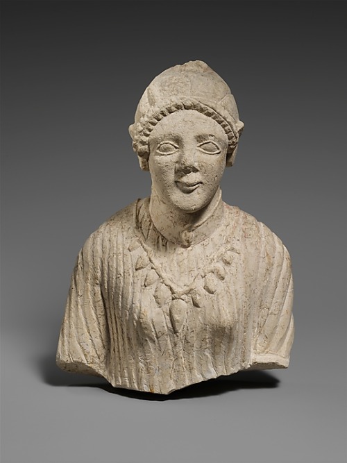 Cypriot limestone upper body of a woman, archaic late 6th century