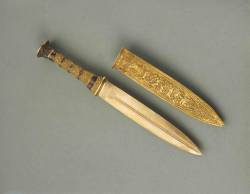 speedwag:  fuckinmiki:  Tutenkhamun’s gold dagger and sheath. 3300 years old.   u took his dagger now how is he supposed to impress anubis? with his muscles? dont be ridiculous