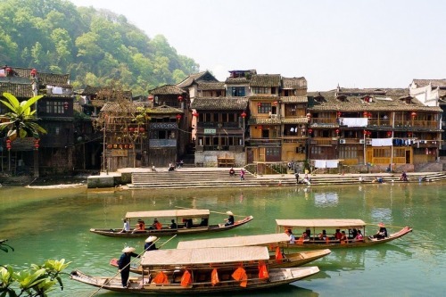 odditiesoflife:  The Ancient Town of Fenghuang, China The town of Fenghuang is located in the Hunan province in China along the banks of the Tuo Jiang River. The town is exceptionally well-preserved and relatively untouched by modern urbanization. The