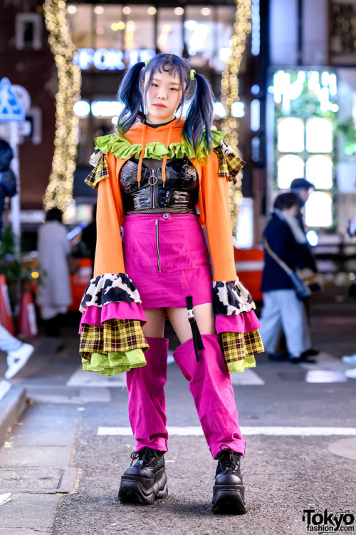 Tokyo-based stylist Pio on the street in Harajuku wearing a handmade ruffle top with oversized flare