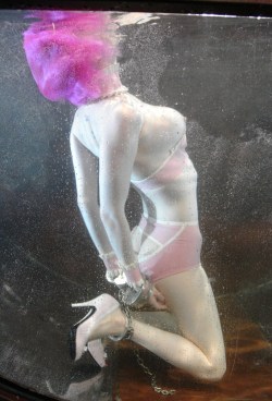 chattelprod:  This is what bath time for this little slave looks like. She’s Daddy’s kitten, perpetually dolled up in something pink and shiny, pierced shut, cuffed, and plugged. She has willingly given up her privilege to speak to become a more perfect