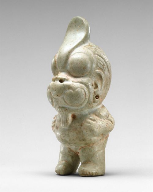 A tiny (4 inch high) figure from the Olmec period in Mexico, 900-600 BCE. The figure depicts either 