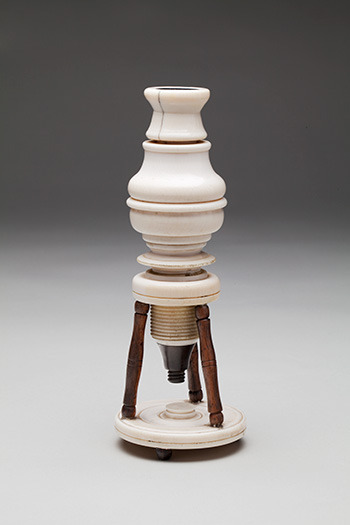 A tripod microscope originating from Italy.  Made from wood, glass, and ivory.  Dated to 1660.Curren