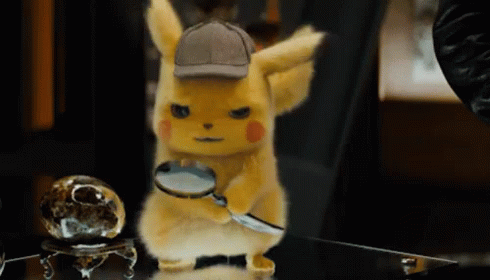 Detective Pikachu looks through a magnifying glass