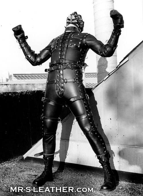 workingsofatwistedmind:  mrsleather:  The Mr. S Fetters Bondage Suit. 25 pounds of leather and hardware, tailored to fit you like a glove. This is JT Blazer wearing this suit on the roof and in front of the old Mr. S store on Folsom & 14th St. 1992
