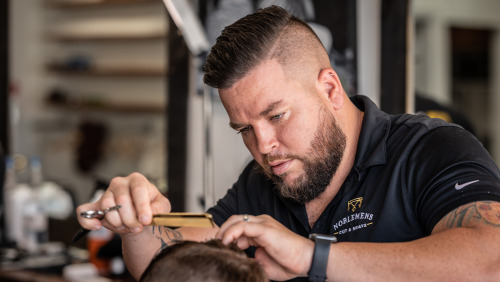 Greg Young talks about offering free haircuts to the homeless through his Backpack Barber Foundation