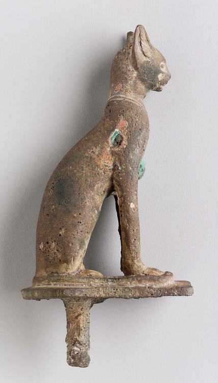 Ancient Egyptian cats2. bronze figurine of a cat attached to black wooden base, 760 BCE-364 CE