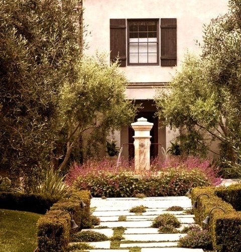 Los Angeles Mediterranean Landscape Photo Of A Large Mediterranean Full Sun Front Yard Gravel Landscaping.