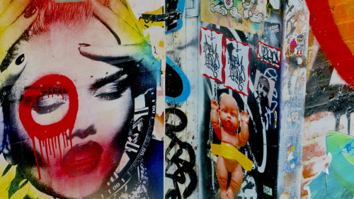 Among All The Art Galleries There Is This Wall With A Lot Of Grafiti That Is Very Artistic