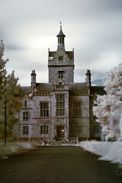 The North Wales Lunatic Asylum was the first psychiatric institution built in Wales; construction began in 1844 and completed in 1848 in the town of Denbigh. The U-shaped Tudorbethain style hospital was built due to the spreading word of mistreatment