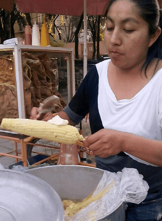 Mexican street food favourite: Hot corn on the cob smothered in mayonnaise, chili, lime and parmesan
