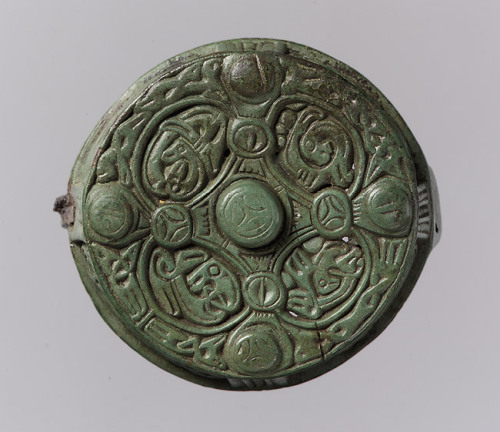 fuckyeahvikingsandcelts:  Round Box Brooch, 700–900  Viking; Made in Gotland, Sweden Copper alloy A menagerie of tiny animals inhabits the interlace patterns on this round brooch. The four oval compartments on the top show beasts with round eyes, open