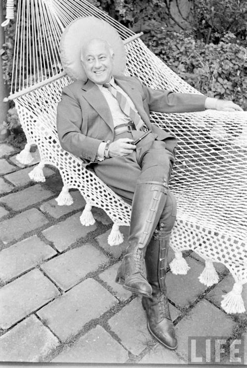 Cecil B. DeMille tries to look comfortable in a hammock(Alfred Eisenstaedt. n.d.)