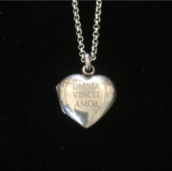 thinkingimages:  Antique French locket given new life and inscribed with the quote “Omnia Vincit Amor” - “Love Conquers All” From @sacredmoonadornments  