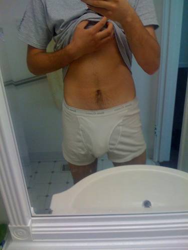 undie-fan-99:  Guy showing off in (what appears to be) his white Hanes boxerbriefs.