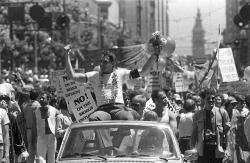 historium:San Francisco Supervisor and gay rights activist Harvey Milk at the 1978 San Francisco Gay Freedom parade, the year he was killed. Upon his election, Milk became the first openly gay person to be elected to public office. 