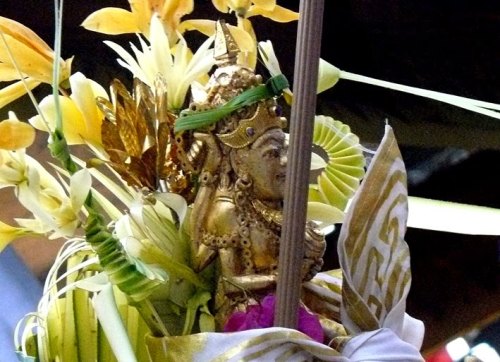 Priest carries Shiva image (pratima) in procession, Bali