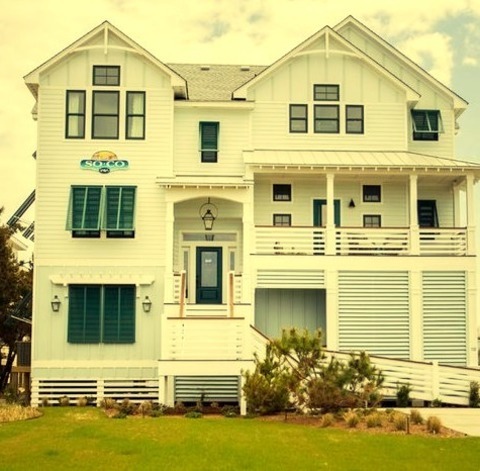 Beach Style ExteriorAn Illustration Of A Substantial White Three-story Vinyl Gable Roof In The Beach
