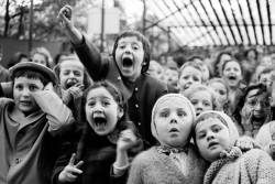 historylover1230: Children watch the story of “Saint George and the Dragon” at an outdoor puppet theater in Paris, 1963, photo by Alfred Eisenstaedt