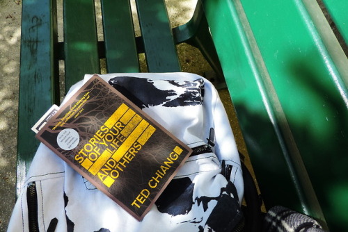 ted chiang on a bag on a bench in paris