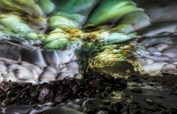 odditiesoflife:  10 of the Most Majestic Caves in the World Ice Cave Near The Mutnovsky Volcano, Russia - Ice caves like these form in the glaciers surrounding the Mutnovsky Volcano in Russia. Some of them are formed by vents that release volcanic heat