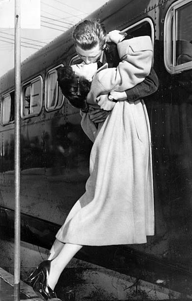 Sgt. 1st Class Owen Marsh of North Hollywood leans out a bus window to pick up his wife, Evelyn, for