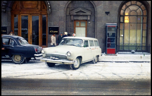 The black Volga sedan and the white Volga ambulance at Astoria Hotel, Leningrad 1970