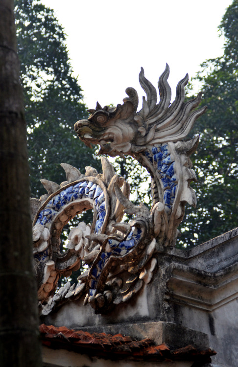 Elaborate stone dragon on a roof at Quan Thanh Temple, Hanoi, Vietnam. 