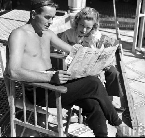 Tyrone Power and Cécile Aubry reading the paper on the set of The Black Rose(Dmitri Kessel. 1949)