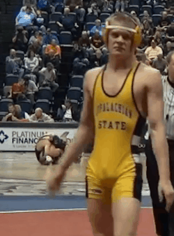 wrestleman199:  app state wrestler packing one hell of a bulge in his singlet!
