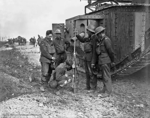 Canadian Soldiers Examine A German Mauser T-Gewehr. Behind Them Is A Male Mark V Tank. August 1918.