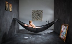  This is a great idea!! The Vessel bathtub is made out of carbon-fiber and is hanging like a hammock. It is designed by Splinter works. 