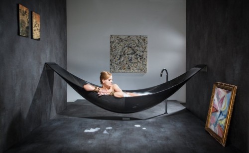 shheryl:  carlosison:   everything-creative:  This is a great idea!! The Vessel bathtub is made out of carbon-fiber and is hanging like a hammock. It is designed by Splinter works.  I WANT THIS!   Move it, lady. You’re in my tub.